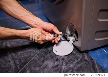Repairing a Washing Machine Hose Connection at Home Requires Handy Skills and Tools Repairing a Washing Machine Hose Connection at Home Requires Handy Skills and Tools 126609471