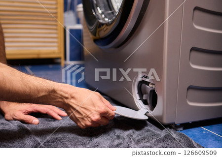 Repairing a Washing Machine Hose Connection at Home Requires Handy Skills and Tools Repairing a Washing Machine Hose Connection at Home Requires Handy Skills and Tools 126609509