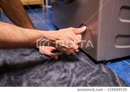 Repairing a Washing Machine Hose Connection at Home Requires Handy Skills and Tools 126609550