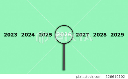 Lens, magnifying glass focusing on the year 2026 on a Green background. Financial or stock market strategies and past and future events. 126610102