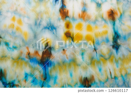 abstract pattern on silk fabric texture in blue, yellow, green colors abstract pattern on silk fabric texture in blue, yellow, green colors 126610117