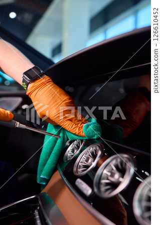Properly Cleaning Your Car Interior Using Microfiber Cloths and Protective Gloves is Important 126610452