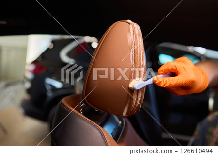 Demonstration of an Expert Car Interior Cleaning Process in Action with Every Detail Considered 126610494