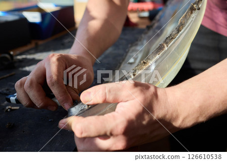 Hands actively engaged in working on advanced technology with various modern gadgets and devices Hands actively engaged in working on advanced technology with various modern gadgets and devices 126610538