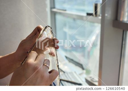 Hands actively engaged in working on advanced technology with various modern gadgets and devices Hands actively engaged in working on advanced technology with various modern gadgets and devices 126610540