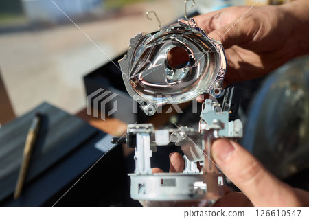 A Detailed Close Up View of an Automotive Headlight Assembly Displaying Quality and Craftsmanship 126610547