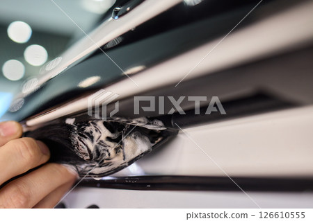 The Car Detailing Process Applying a Protective Coating for Shine and Longevity 126610555