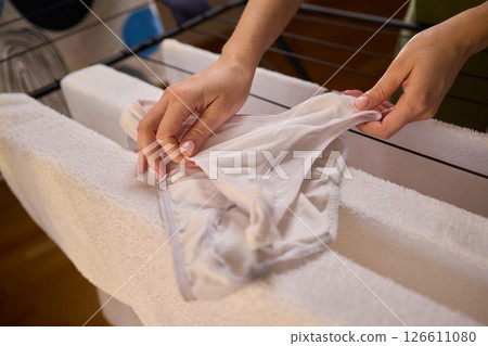 Laundry Day Freshly Cleaned Underwear Elegantly Hanging Outside to Dry in the Sun Laundry Day Freshly Cleaned Underwear Elegantly Hanging Outside to Dry in the Sun 126611080