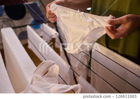 Laundry Day Freshly Cleaned Underwear Elegantly Hanging Outside to Dry in the Sun 126611083