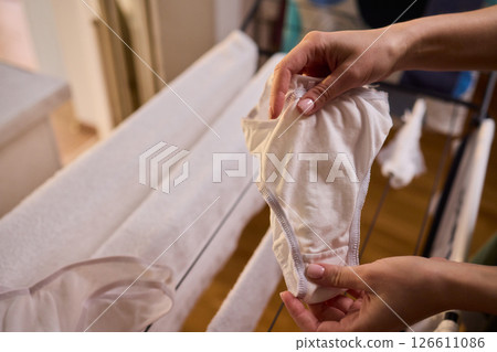 Laundry Day Freshly Cleaned Underwear Elegantly Hanging Outside to Dry in the Sun Laundry Day Freshly Cleaned Underwear Elegantly Hanging Outside to Dry in the Sun 126611086