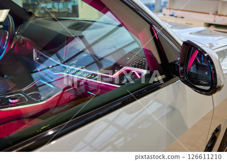 An elegant closeup shot of a sleek car side mirror showcasing its design and details 126611210