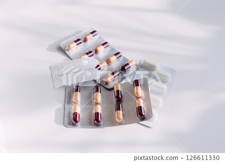 Pills on light background. Medicine theme. 126611330