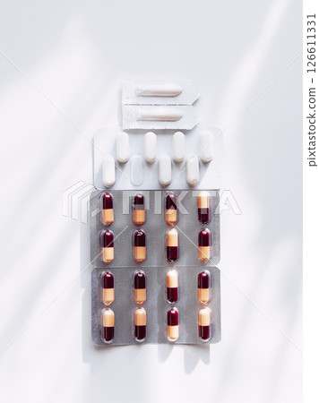Pills on light background. Medicine theme. Pills on light background. Medicine theme. 126611331