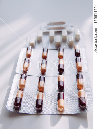 Pills on light background. Medicine theme. Pills on light background. Medicine theme. 126611334