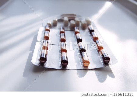 Pills on light background. Medicine theme. 126611335