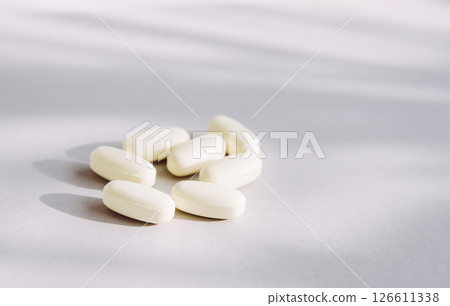 Pills on light background. Medicine theme. 126611338