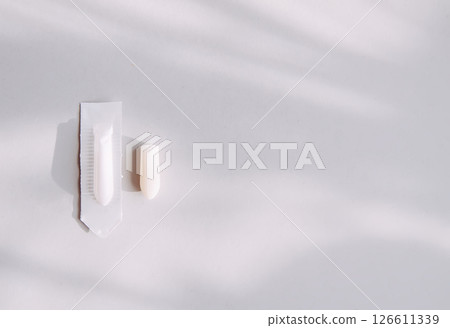 Medical candle suppository on light background. 126611339