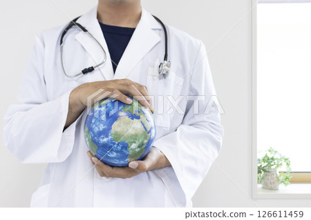 Image of a doctor holding a globe (Japanese, male, no face, 30s) Image of a doctor holding a globe (Japanese, male, no face, 30s) 126611459