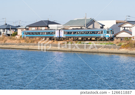 [Mugi Line] Limited express train running along the riverside 126611887