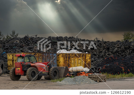 Manitou Loader Moves Tires at Recycling Plant Manitou Loader Moves Tires at Recycling Plant 126612190