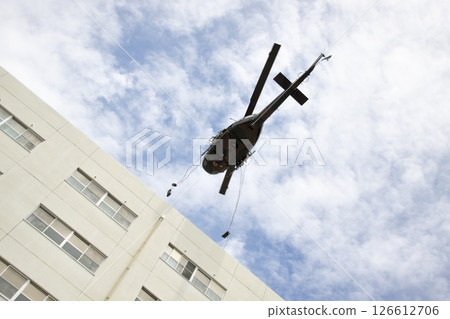 Training demonstration UH-1 helicopter rappelling 2 126612706