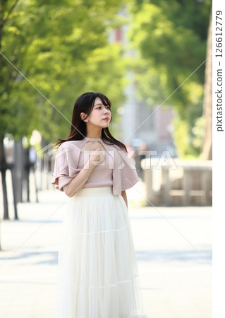 A young lady walking in the city A young lady walking in the city 126612779