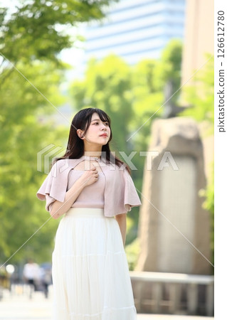 A young lady walking in the city A young lady walking in the city 126612780