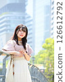 Woman looking at camera on promenade 126612792