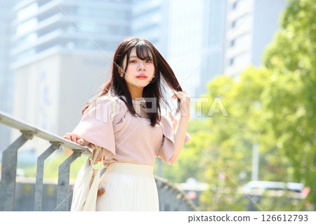 Woman looking at camera on promenade 126612793