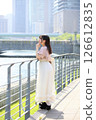 Woman looking at the view by the river 126612835