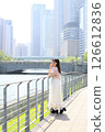 Woman looking at the view by the river 126612836