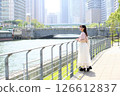 Woman looking at the view by the river 126612837