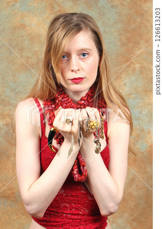 Holding fancy jewelry 126613203