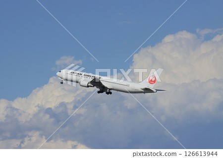 Passenger plane taking off and ascending jet plane 126613944
