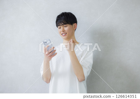 Young man using a smartphone Young man using a smartphone 126614351