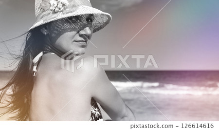 young woman in hat on beach. woman in bikini and sun hat young woman in hat on beach. woman in bikini and sun hat 126614616