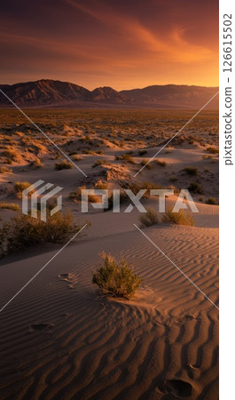 Desert Landscape at Sunset with Sand Dunes and Mountains 126615502