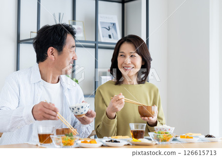 Middle-aged couple eating breakfast 126615713