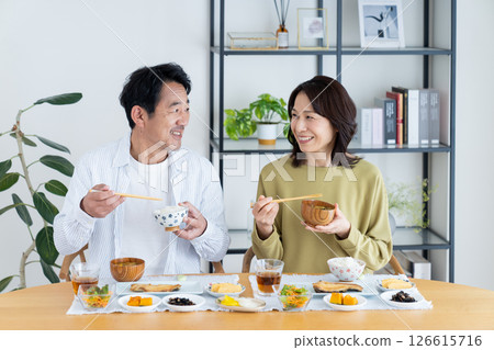 Middle-aged couple eating breakfast 126615716