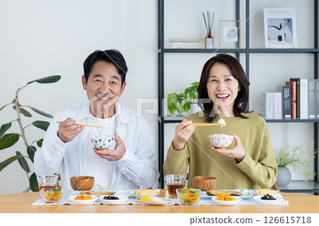 Middle-aged couple eating breakfast 126615718
