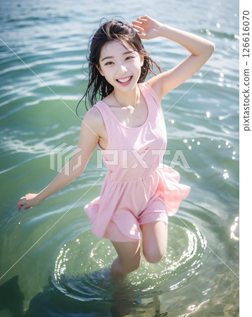 A girl playing water 126616070