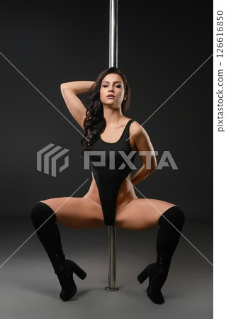 Captivating dance performance by a woman showcasing strength and elegance Captivating dance performance by a woman showcasing strength and elegance 126616850