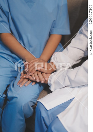 Close up images, The doctor holding hands patient to give advice and encourage To fight the disease And cheer to receive treatment, to elderly patient and health care concept. Close up images, The doctor holding hands patient to give advice and encourage To fight the disease And cheer to receive treatment, to elderly patient and health care concept. 126617502