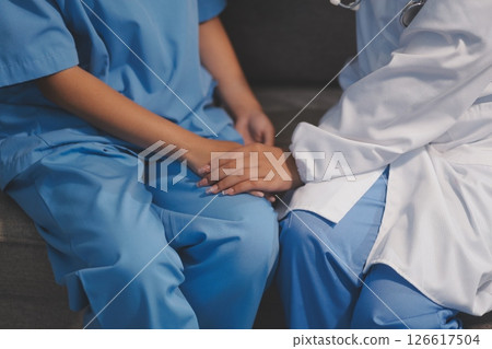 Close up images, The doctor holding hands patient to give advice and encourage To fight the disease And cheer to receive treatment, to elderly patient and health care concept. Close up images, The doctor holding hands patient to give advice and encourage To fight the disease And cheer to receive treatment, to elderly patient and health care concept. 126617504