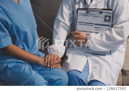 Close up images, The doctor holding hands patient to give advice and encourage To fight the disease And cheer to receive treatment, to elderly patient and health care concept. Close up images, The doctor holding hands patient to give advice and encourage To fight the disease And cheer to receive treatment, to elderly patient and health care concept. 126617505