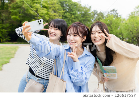 A woman taking a picture A woman taking a picture 126617557