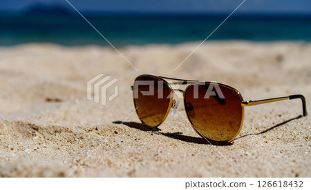 Sandy beach and sunglasses 126618432