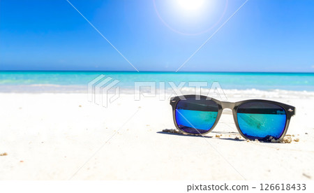 Sandy beach and sunglasses 126618433