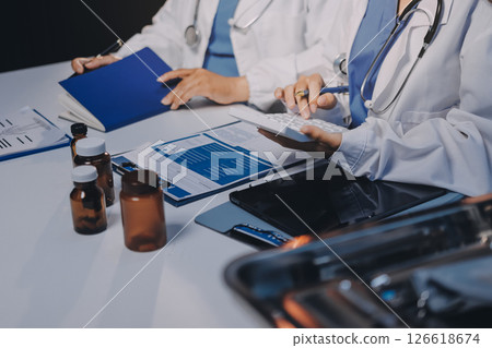 doctors and nurse having informal meeting in hospital canteen 126618674