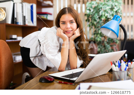 Young female posing at workplace in office 126618775